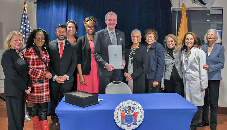 Governor Phil Murphy and others at a bill signing